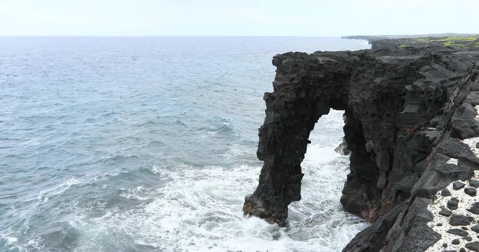 Volcano National Park Hawaii Holei Sea Arch. Most active volcano in the USA. Smoke, steam, gasses. On the Big Island in Volcano National Park. Small eruptions and lava flow continually.