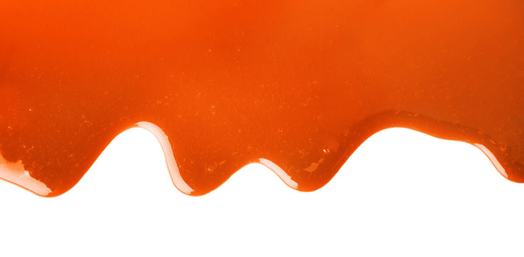 Yummy caramel sauce on white background