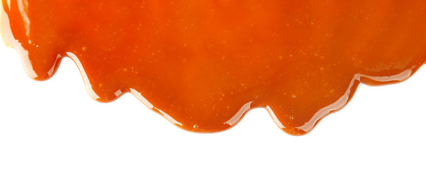 Yummy caramel sauce on white background