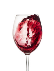 a splash of red wine in a glass