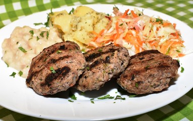 Triple meatballs of delicious calf minced with cabbage, beans and potatoes