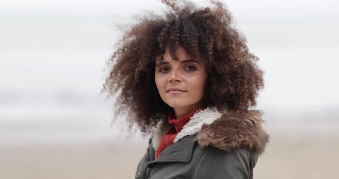 Portrait of young female on a winter beach break