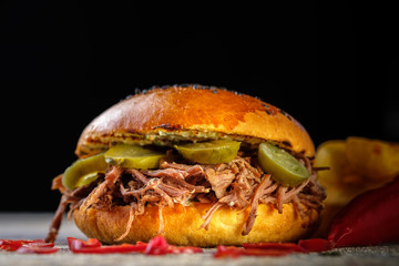 Fresh juicy delicious homemade burger. Hamburger with meat and fresh herbs.