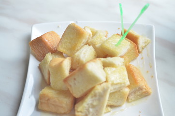 Toast with Sweetened Condensed Milk on White marble table.in cafe.