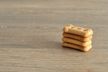 Dog biscuits isolated on a wooden background