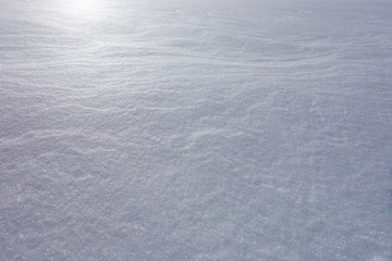 Fototapeta na wymiar snowed ground with a sun bounce on the left