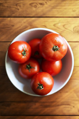 tomatoes on wooden table