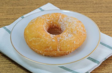 Glazed Donut with Sugar on White Dish