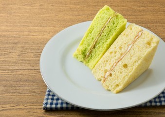 Triangle Pandan and Vanilla Chiffon Cake on A Dish