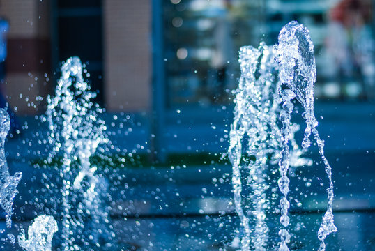 The gush of water of a fountain. Splash of water in the fountain, abstract image