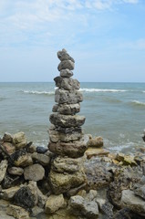 Fototapeta na wymiar Rock sculpture by water