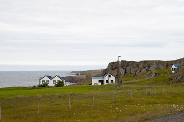 Coast in a typical Icelandic landscape Vatnsnes Peninsula, a wild nature of rocks and shrubs, rivers and lakes. © RiCi