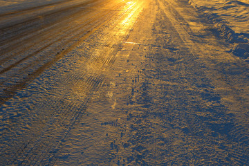 The icy road. Frosty winter sunset.