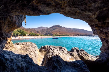 Papier Peint photo Plage de Camps Bay, Le Cap, Afrique du Sud The amazing tropical beach of Panagia Tripiti through a cave, in Crete, with sandy beach, turquoise water and some lucky campers, Greece.