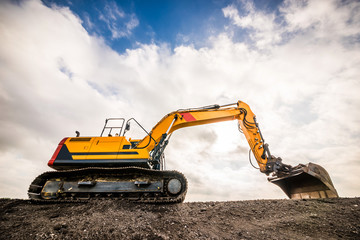 Big excavator in construction site