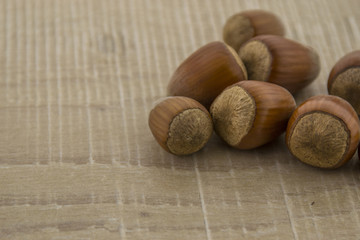 Hazelnuts on a wooden surface