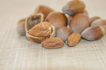 Hazelnuts on a wooden base
