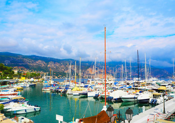 Fototapeta na wymiar Yachts in port of Saint-Jean-Cap-Ferrat - resort and commune in southeast of France on promontory of Cote d'Azur in Provence-Alpes-Cote d'Azur region,department of Maritime Alps,Nice district, France