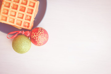Winter style delicious pastries. Closeup of waffles on light table background. Top side view on tasty natural decoration. Xmas classic lifestyle