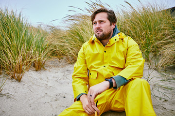 fisherman sitting on beach