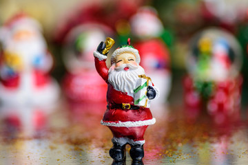 Small Christmas ornaments arranged into a holiday festive scene
