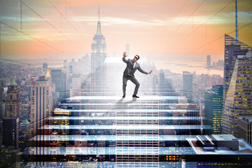 Businessman in uncertainty concept on career ladder