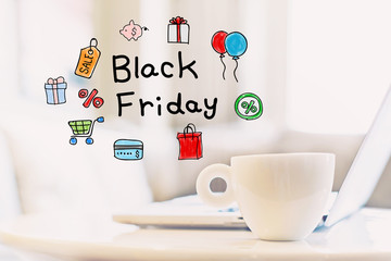 Black Friday concept with a cup of coffee and a laptop