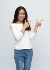 Beauty young girl with charming smile to you and points to the fact that fun smile with isolated on white background