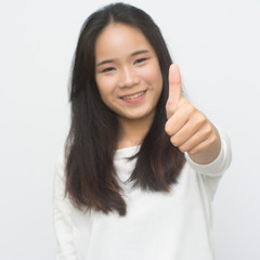 Happy young woman giving thumbs up isolated on white  background