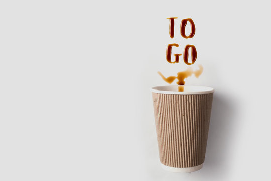 Letters Of Spilled Coffee. Paper Cup And Coffee Take-out. Coffee To Go. Copy Space For Text