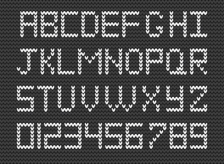Knit alphabet and numerals on grey knitted background. Vector illustration of  Fabric script.