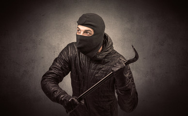 Burglar with tool.