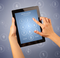 Female hand holding tablet