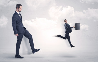 Fototapeta premium Big boss kicking little employee