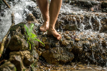 bare female feet on the water
