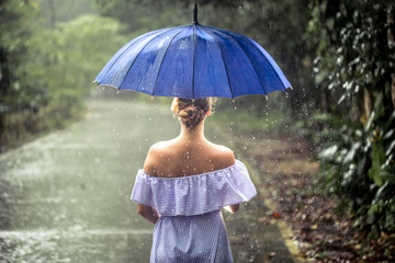girl with umbrella under the rain