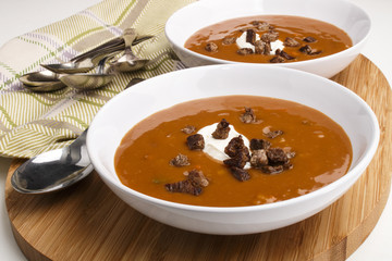 beef soup with sour cream in a deep plate