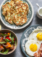 Breakfast - potatoes green peas pancakes, fried eggs, salad. Delicious, nutritious meals concept