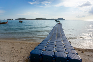 Harbour from plastic module for small boat extended to the sea.