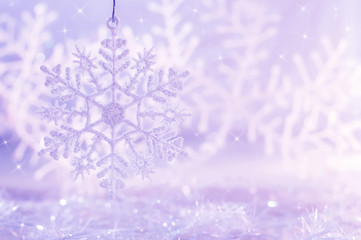 Light purple background with snowflakes. Christmas background.