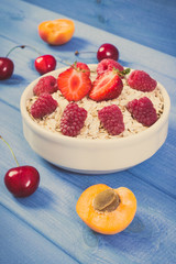 Vintage photo, Fresh prepared oat flakes and oatmeal with fruits, healthy lifestyle and nutrition