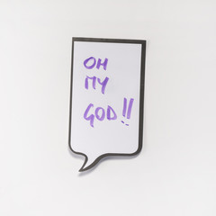 a white memo pad with the shape of a comic with the inscription "oh my God"