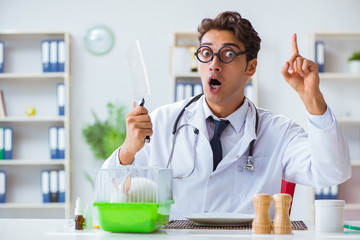 Mad crazy doctor preparing to eat rabbit