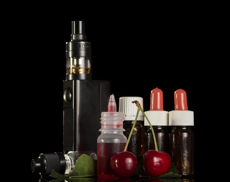 Bottles with aromatic liquids for smoking and electronic cigarette isolated on black background