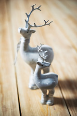 Christmas deer on a wooden floor.