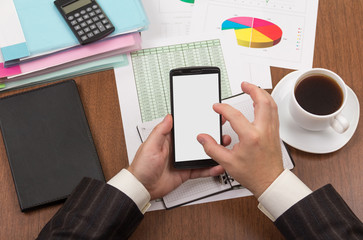 Office table, coffee, folders with papers