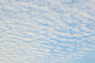 The sky is speckled with clouds.