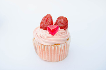 Delicious strawberry cupcakes with heart-shaped jelly are perfect for Valentine's Day backgrounds.