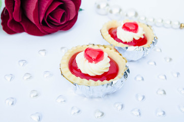 Strawberry tart with heart-shaped jelly is the perfect Valentine's Day background.