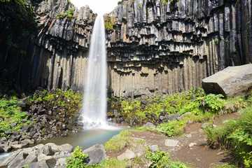 Svartifoss waterfall surrounded by dark lava columns,Iceland